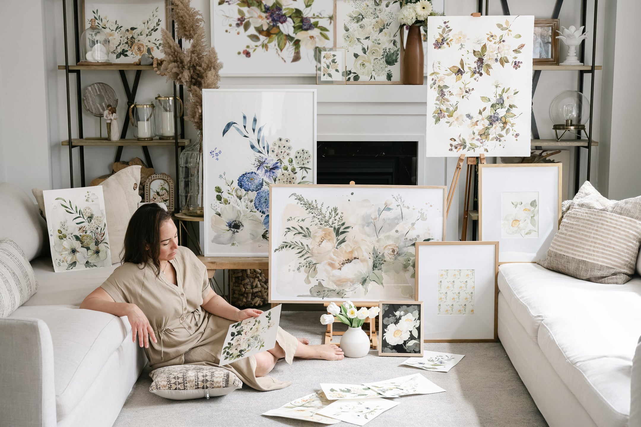 Artist surrounded by beautiful floral art work